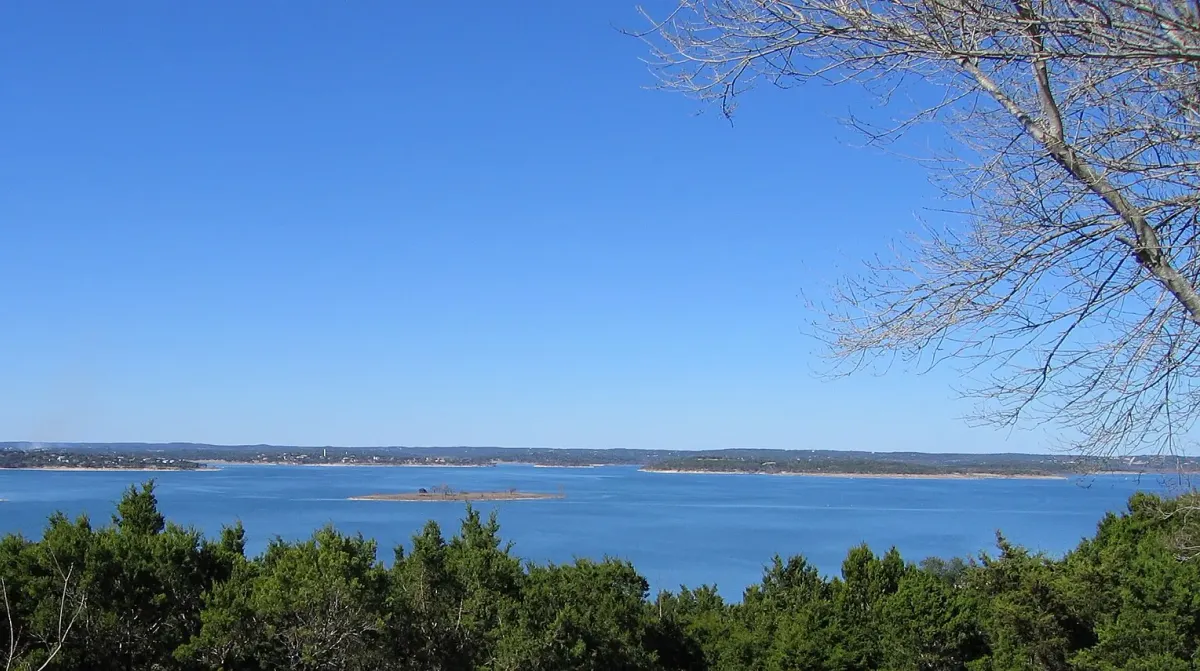Canyon Lake seen over juniper treetops in the Texas Hill Country